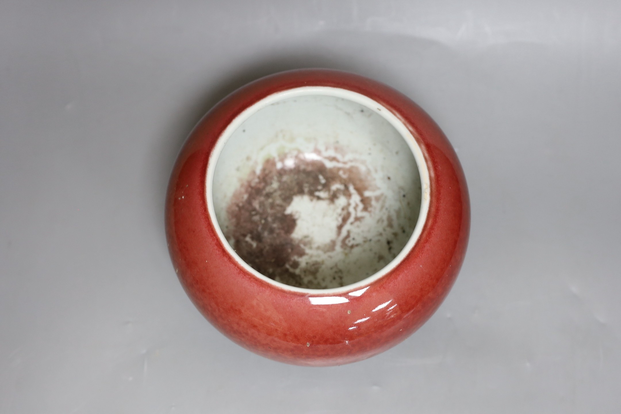 A Chinese sang de boeuf glazed jardiniere, 14cm tall